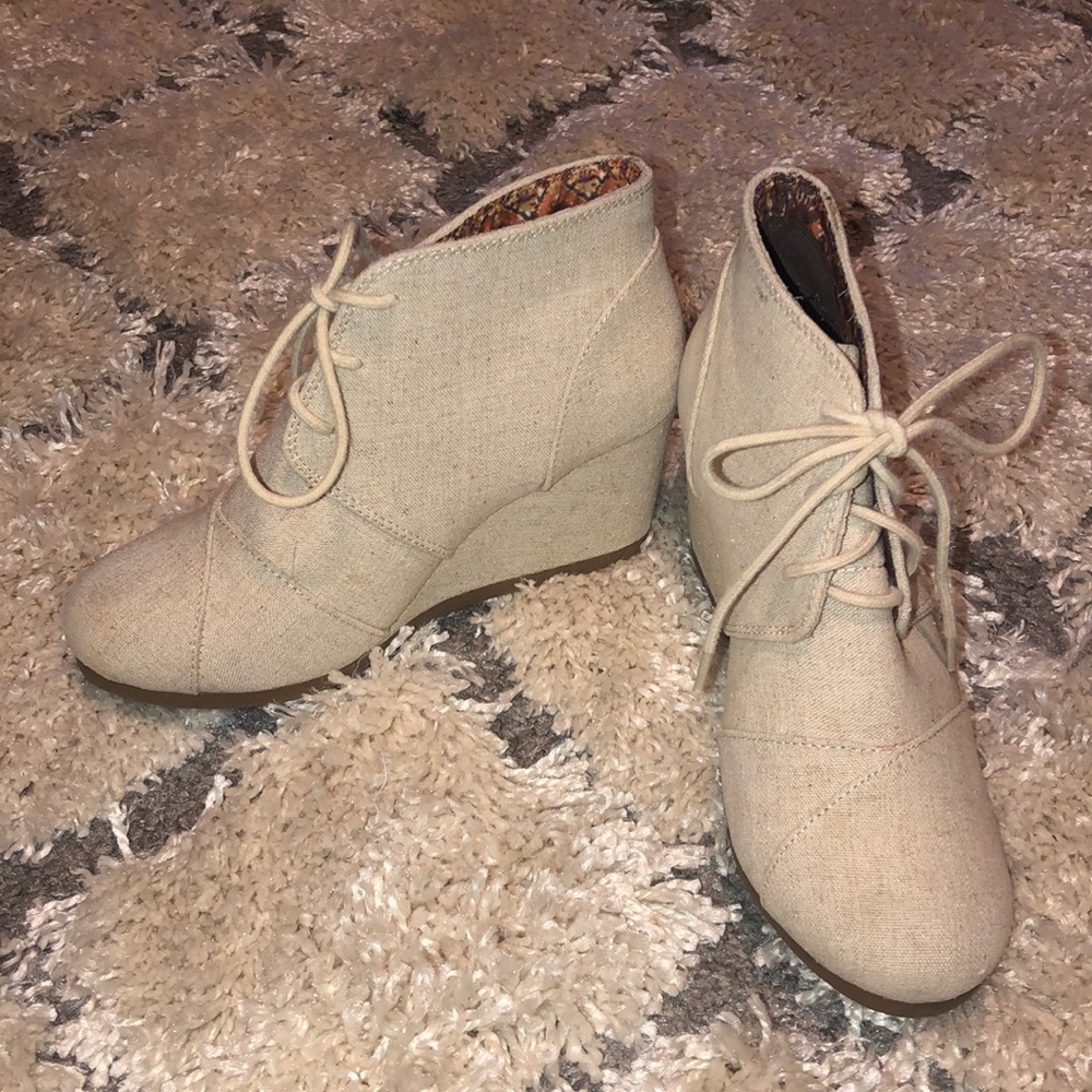 Cream colored wedge booties